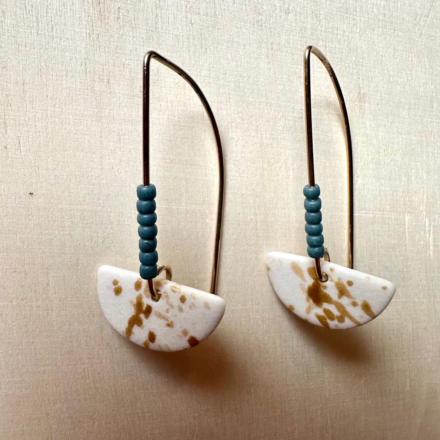 Beaded half-moon dangle earring