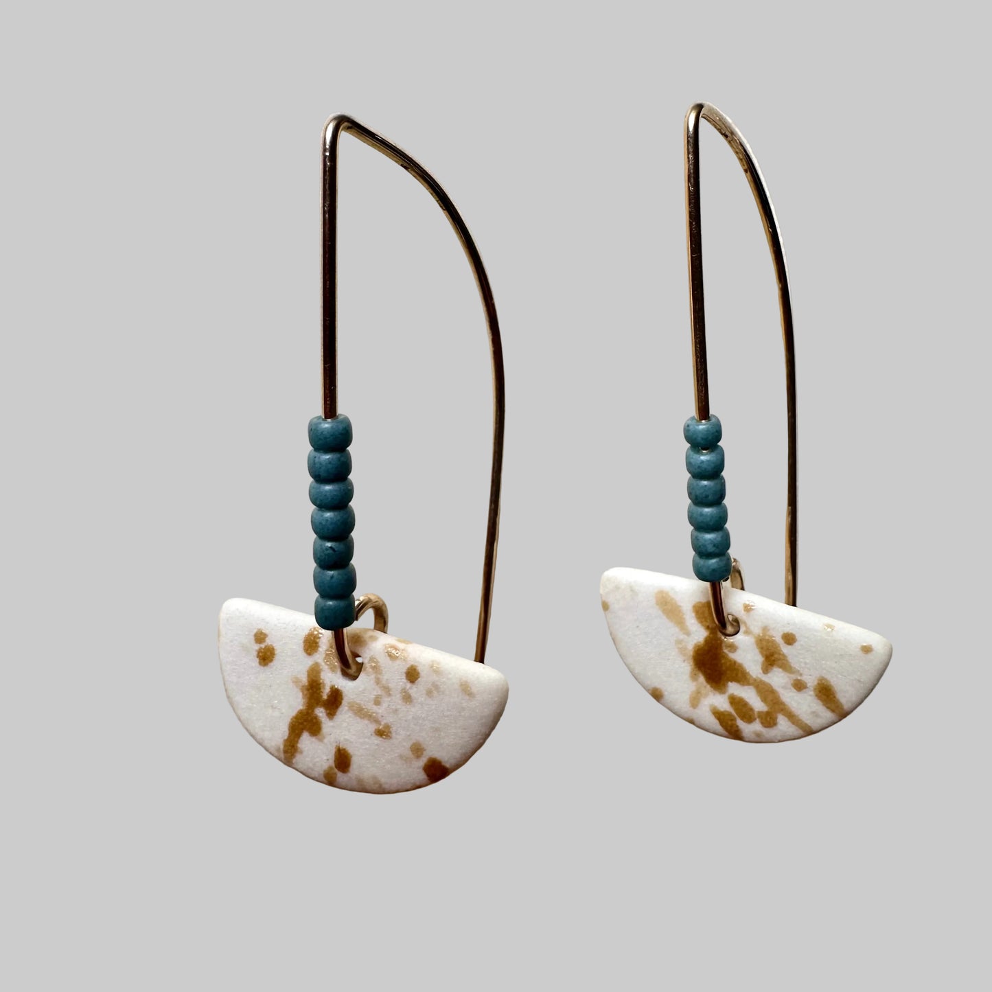 Beaded half-moon dangle earring- copper blue