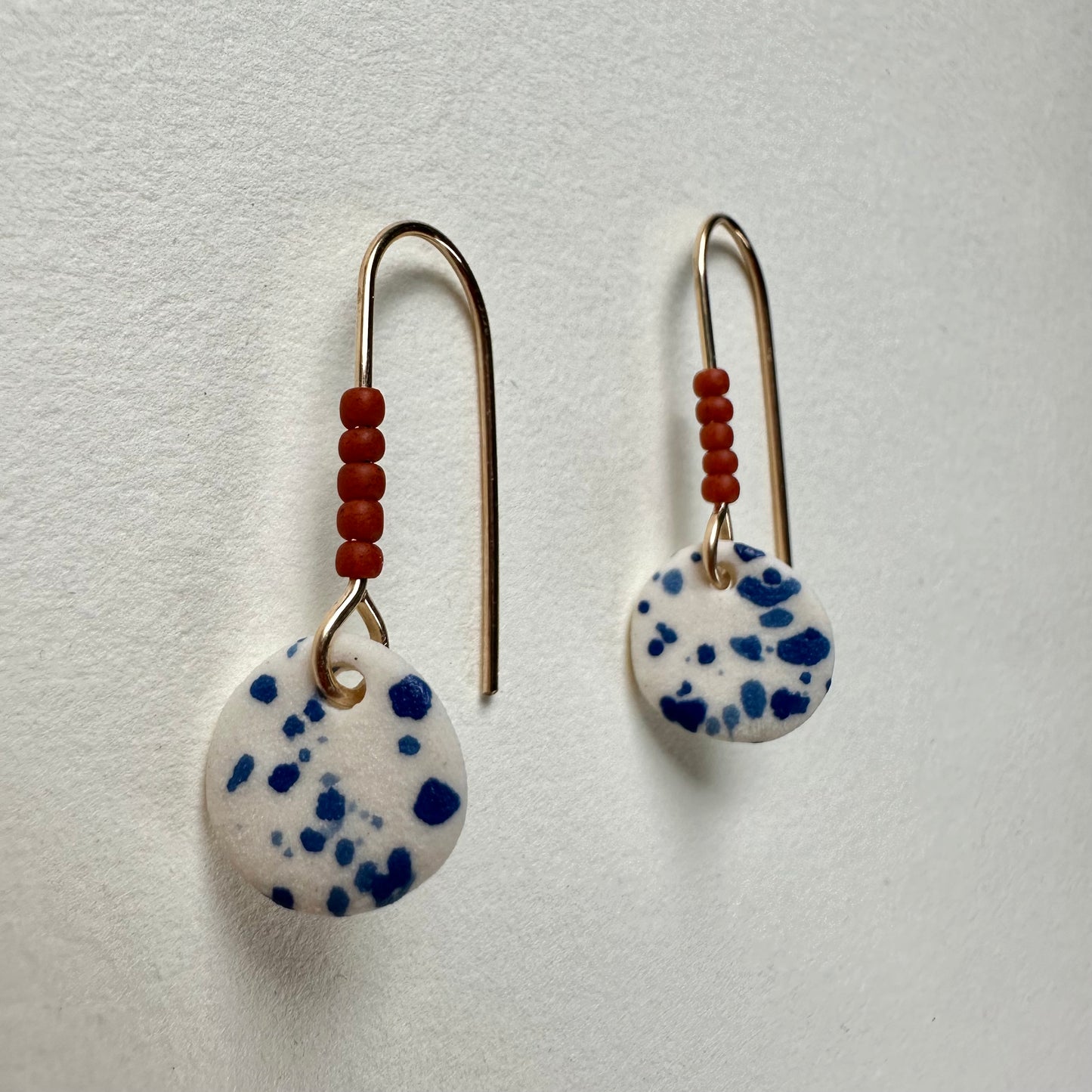 Beaded flicker full moon  dangle earring- azul & rust