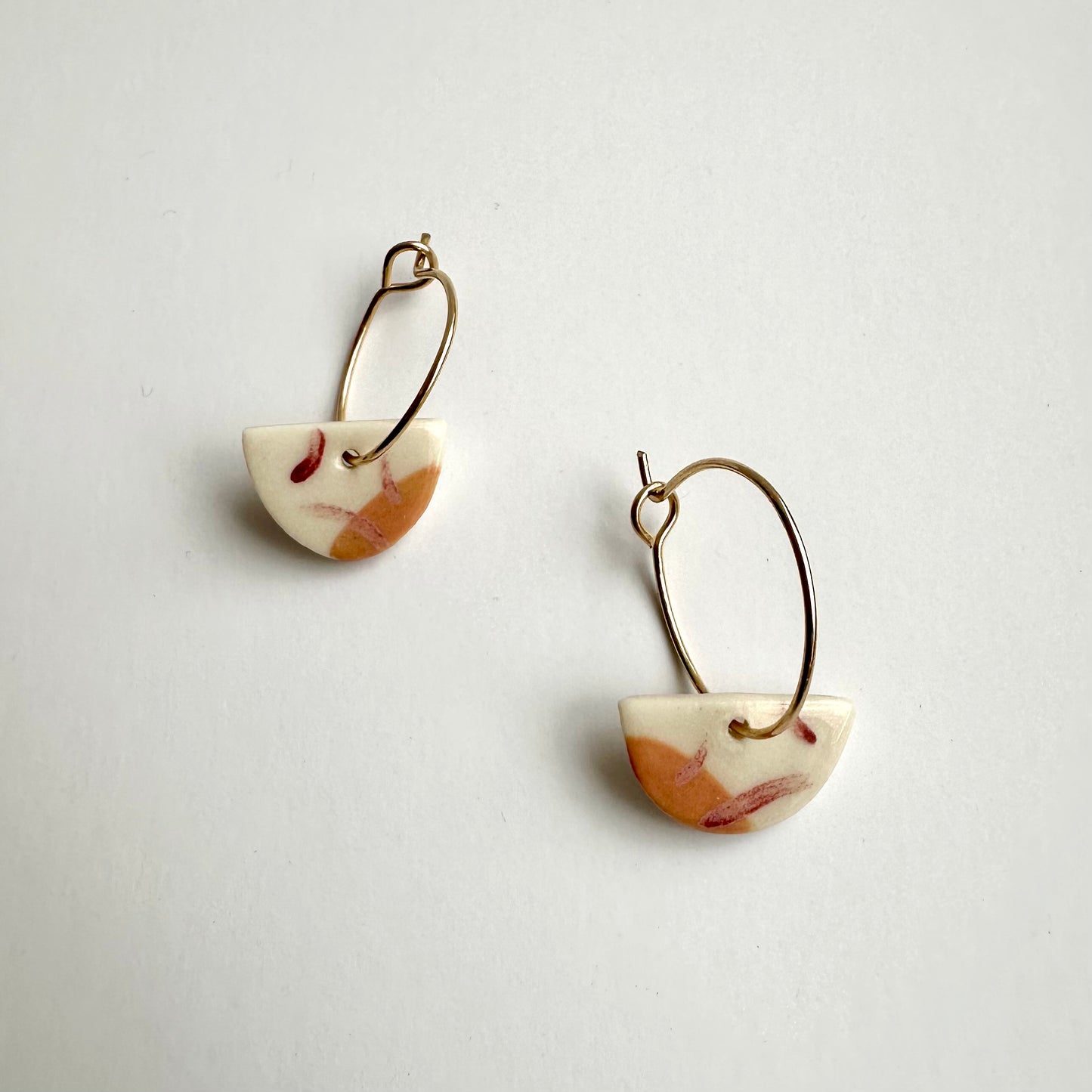 abstract painted half-moon hoop earring